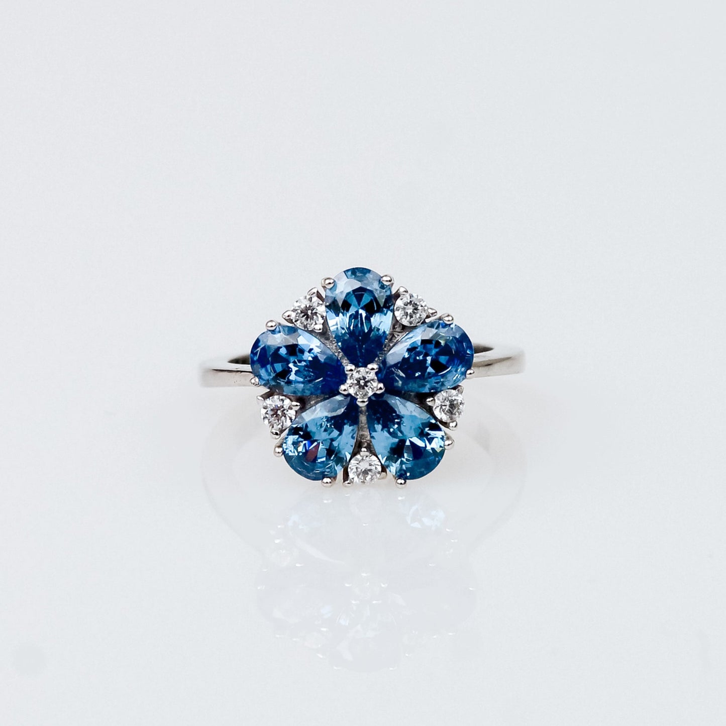 Anillo Flor de Plata 925 con Zafiro y Topacio Blanco